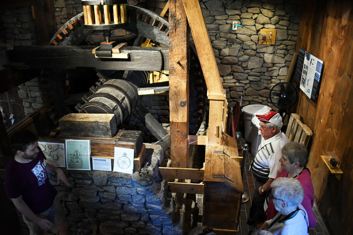 012 Dick Luethje, Marge Bredow and Joyce Hamling examine the gristmill machinery on the lower level.jpg